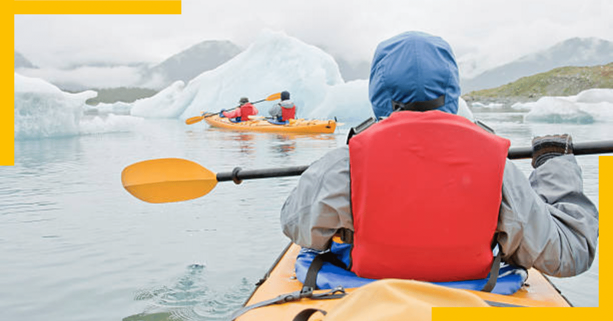 A man kayaking through the Kenai Peninsula