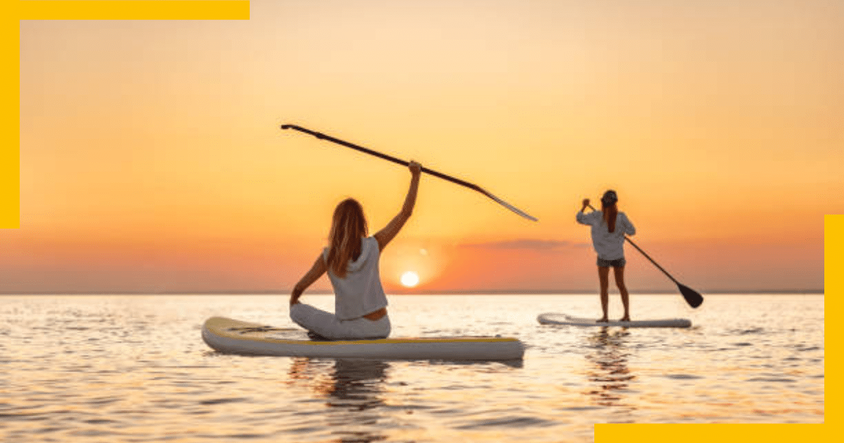 Two Girls paddleboarding