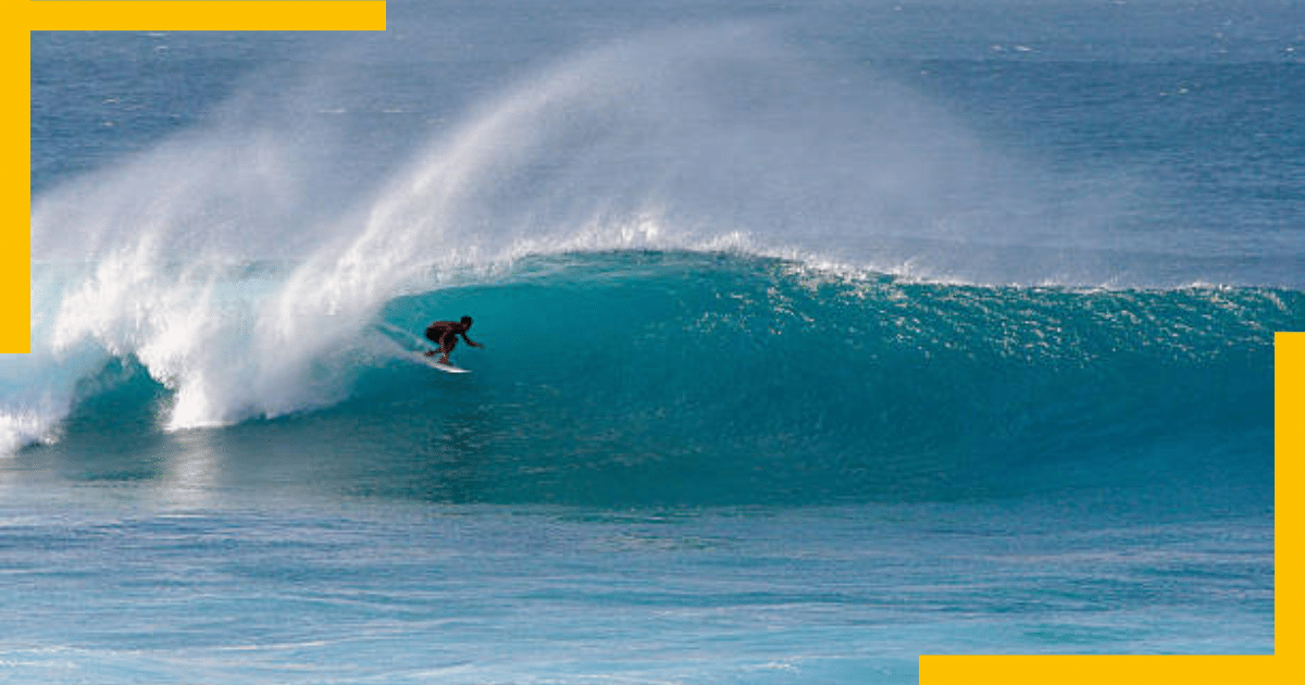 A man surfing in high tide