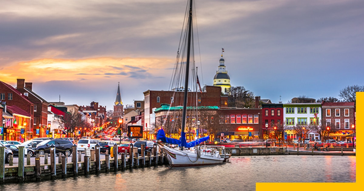 United States, Annapolis, MD, harbour image of sea, boat, card and buildings at sunset