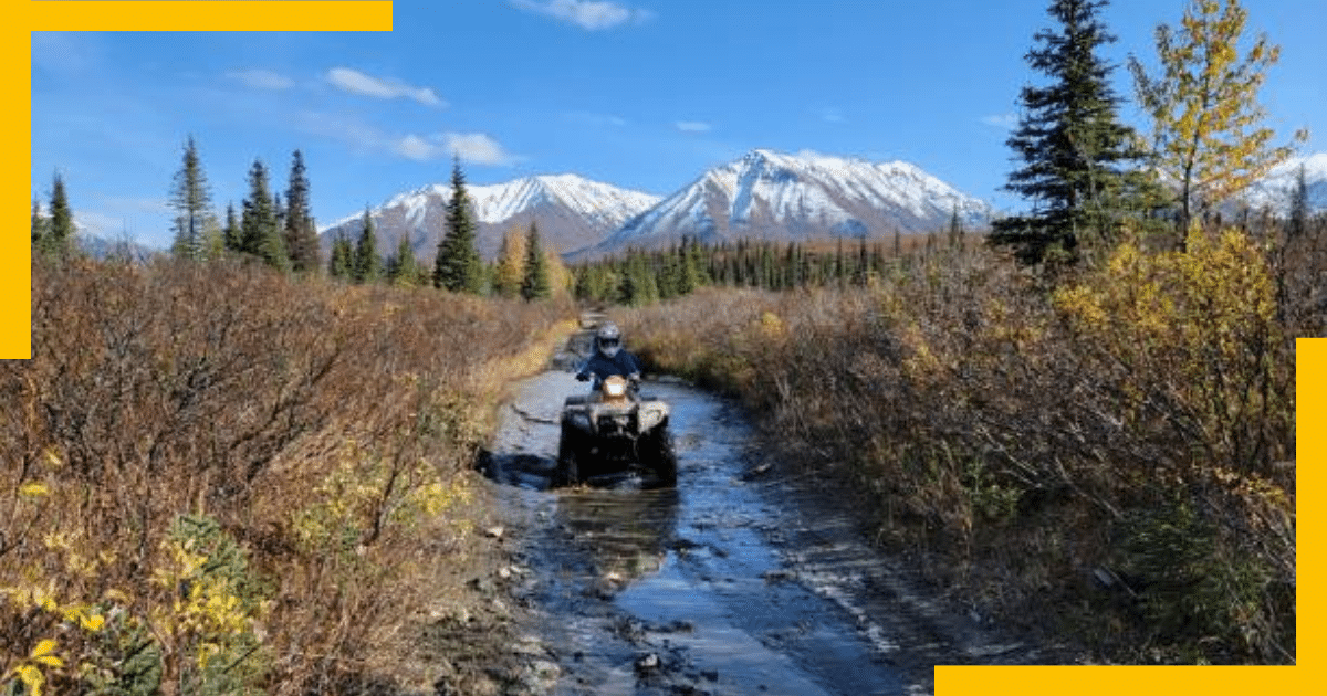 A person riding an ATV bike