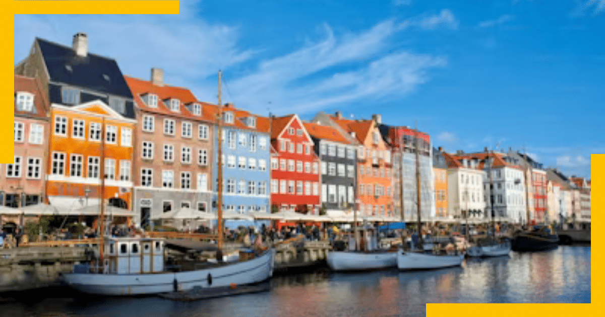 A serene canal scene in Copenhagen, with charming waterfront houses and boats