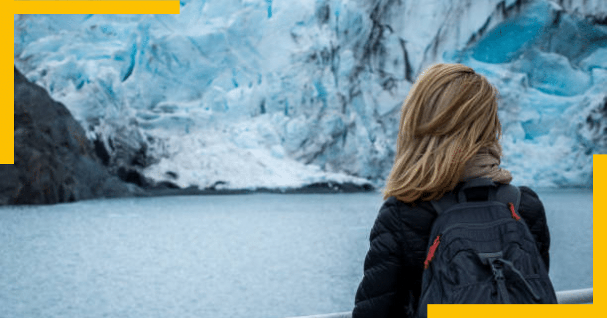 A woman sightseeing the Portage Glacier