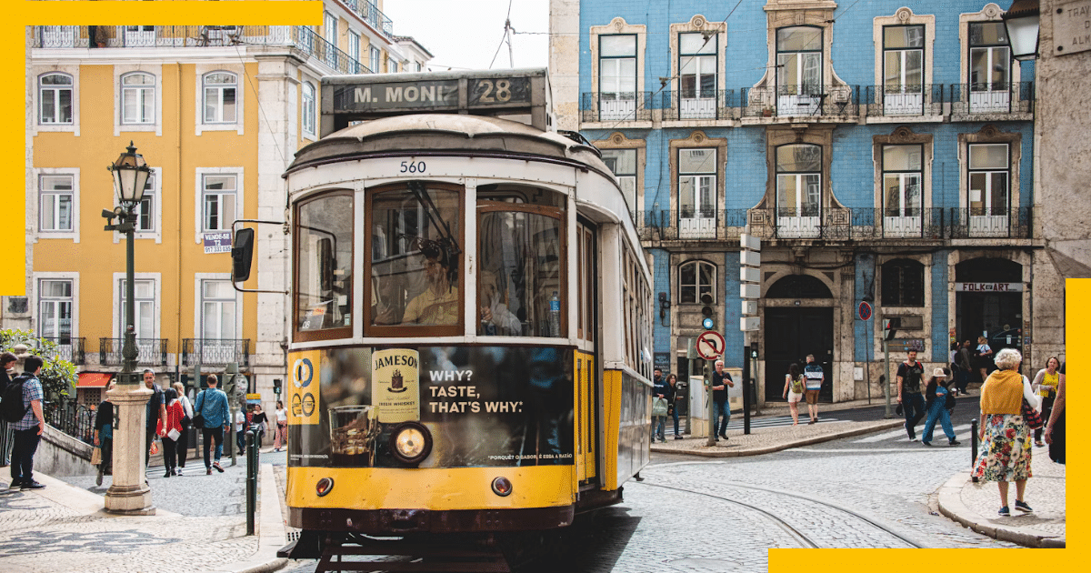 Lisbon's colorful streets and tiled facades, with trams passing by.