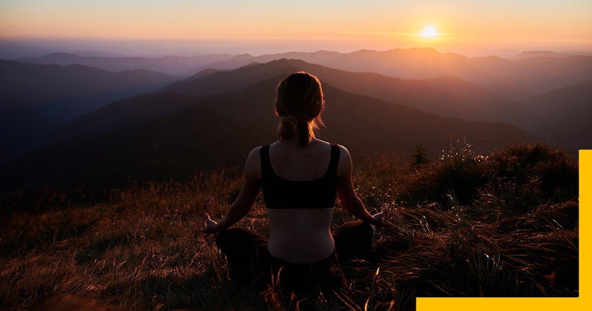 Best Places to Solo Travel-Meditating-female-is-relaxing-mountains