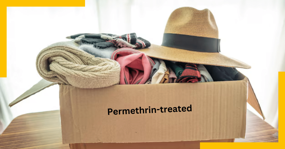 A box with clothes labeled as Permethrin Treated