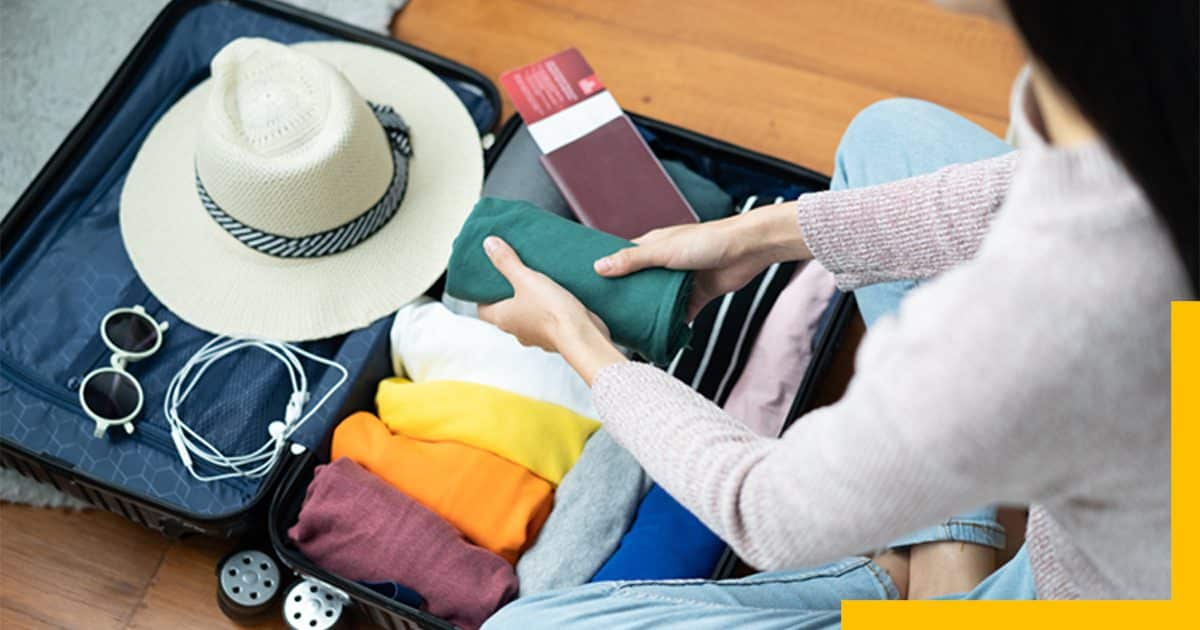 Women Packing Suitcase for Travel