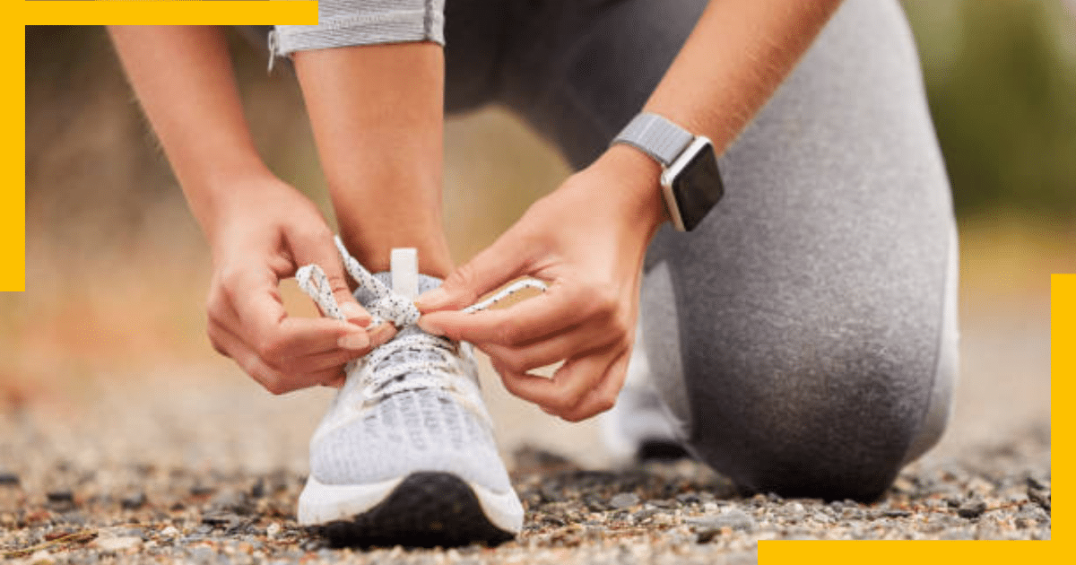 A person tying shoe laces